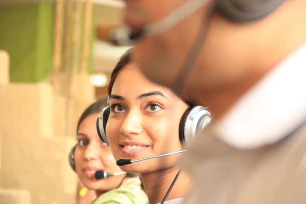 Woman in headset working in customer service call centre